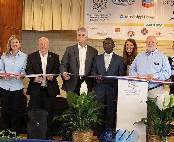 business community at a trade show ribbon cutting ceremony