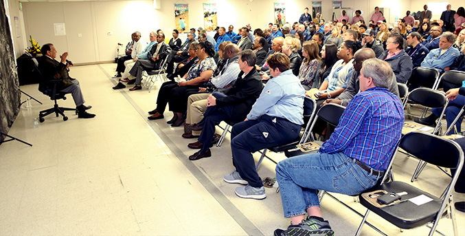 approximately 200 participants listening to Andrew Young