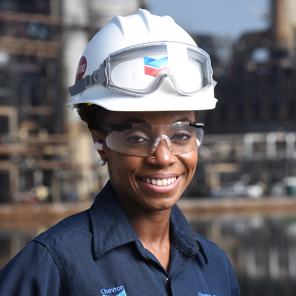 female refinery employee